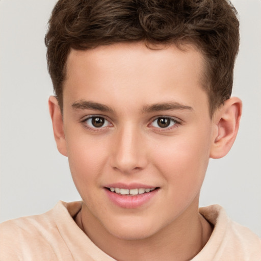 Joyful white child male with short  brown hair and brown eyes