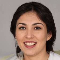 Joyful white young-adult female with medium  brown hair and brown eyes