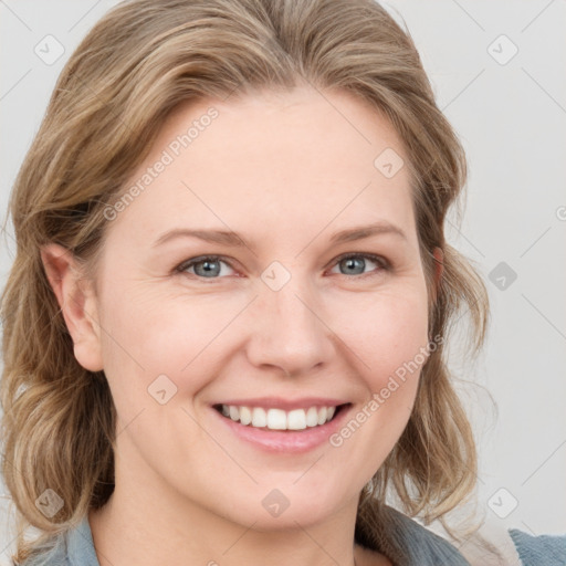 Joyful white young-adult female with medium  brown hair and blue eyes