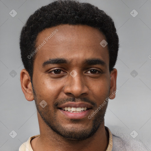 Joyful black young-adult male with short  black hair and brown eyes