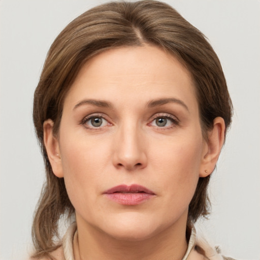 Neutral white young-adult female with medium  brown hair and grey eyes