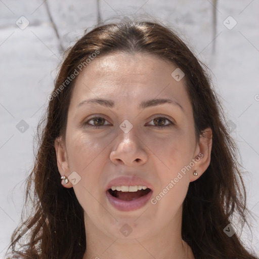 Joyful white adult female with long  brown hair and brown eyes