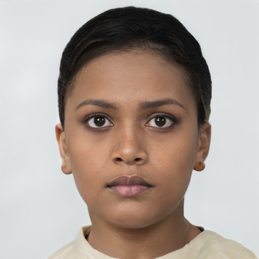 Neutral black young-adult female with short  brown hair and brown eyes