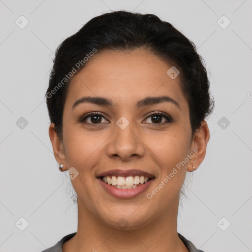 Joyful latino young-adult female with short  brown hair and brown eyes