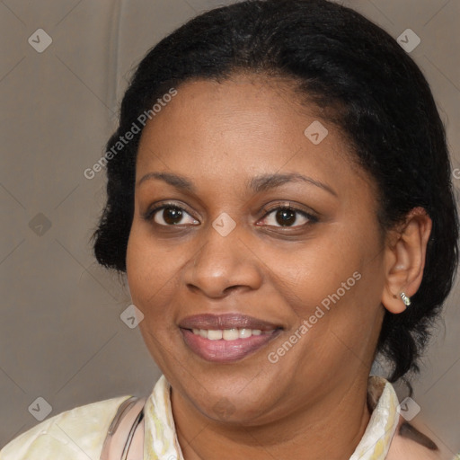 Joyful black adult female with medium  brown hair and brown eyes