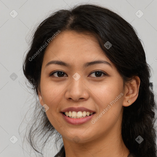 Joyful latino young-adult female with long  brown hair and brown eyes