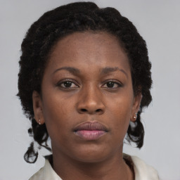 Neutral black young-adult female with short  brown hair and brown eyes