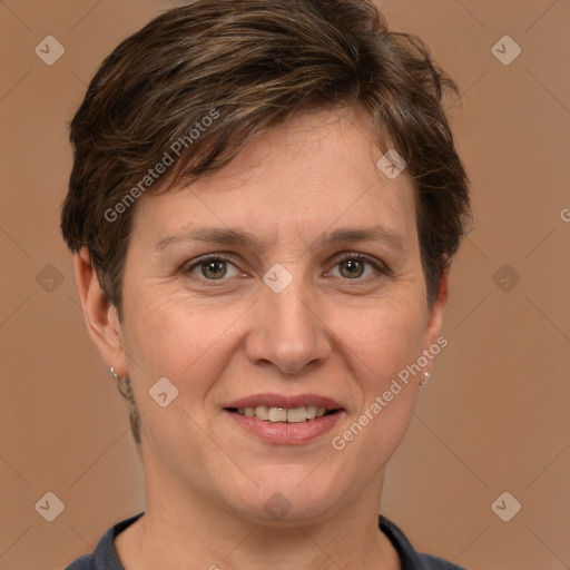 Joyful white adult female with short  brown hair and grey eyes