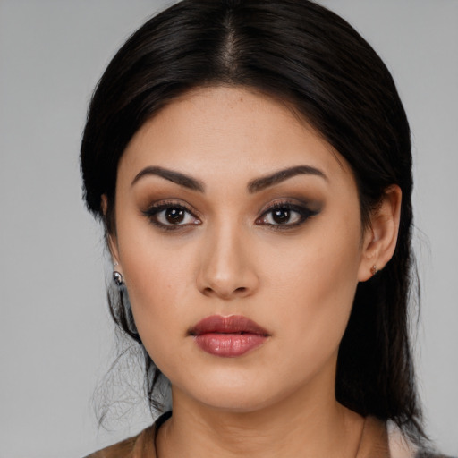 Neutral latino young-adult female with long  black hair and brown eyes