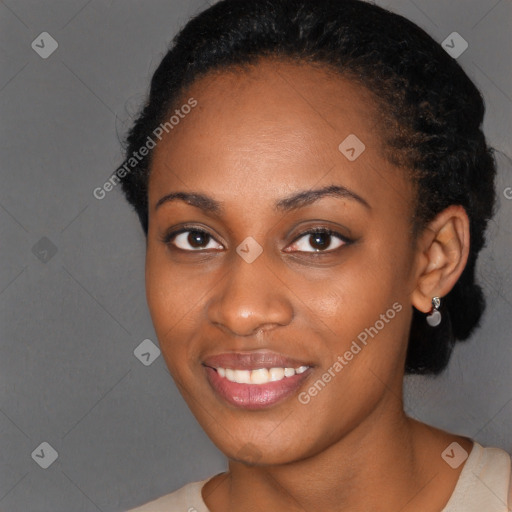 Joyful black young-adult female with short  black hair and brown eyes