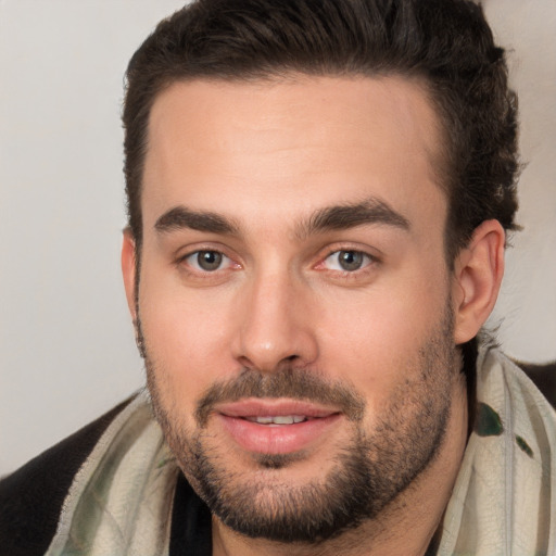 Joyful white young-adult male with short  brown hair and brown eyes