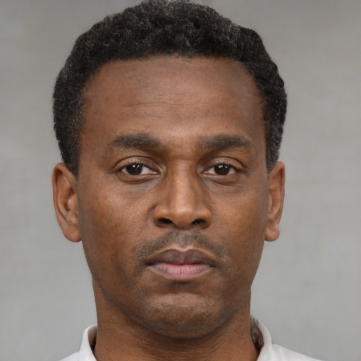 Neutral black young-adult male with short  brown hair and brown eyes