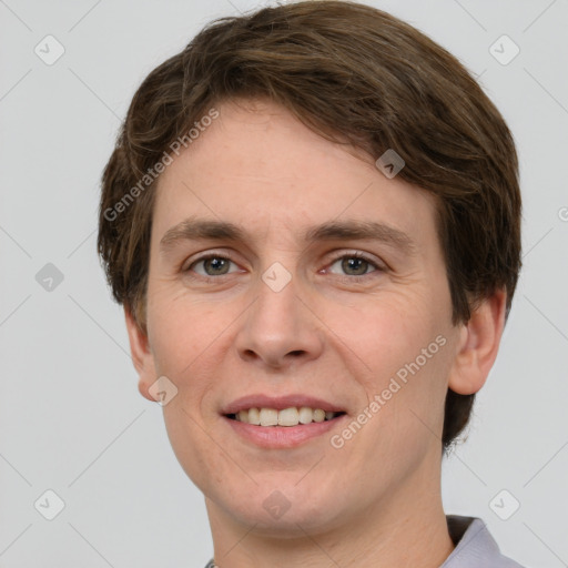 Joyful white adult male with short  brown hair and grey eyes