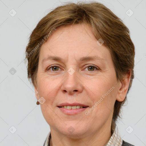 Joyful white adult female with short  brown hair and grey eyes