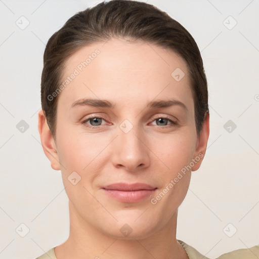 Joyful white young-adult female with short  brown hair and grey eyes