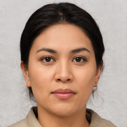 Joyful asian young-adult female with medium  brown hair and brown eyes
