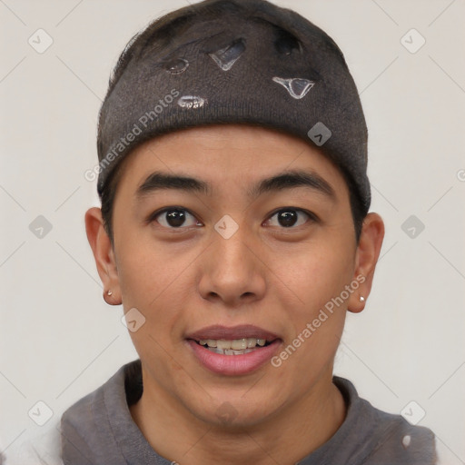 Joyful latino young-adult male with short  brown hair and brown eyes