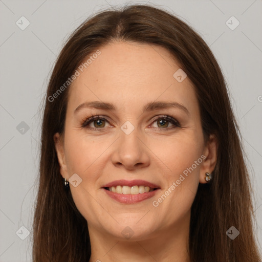 Joyful white adult female with long  brown hair and grey eyes