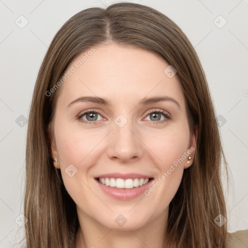 Joyful white young-adult female with long  brown hair and grey eyes