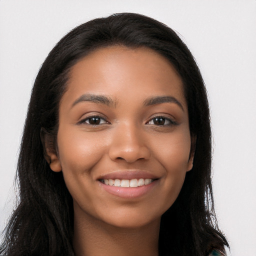 Joyful latino young-adult female with long  black hair and brown eyes