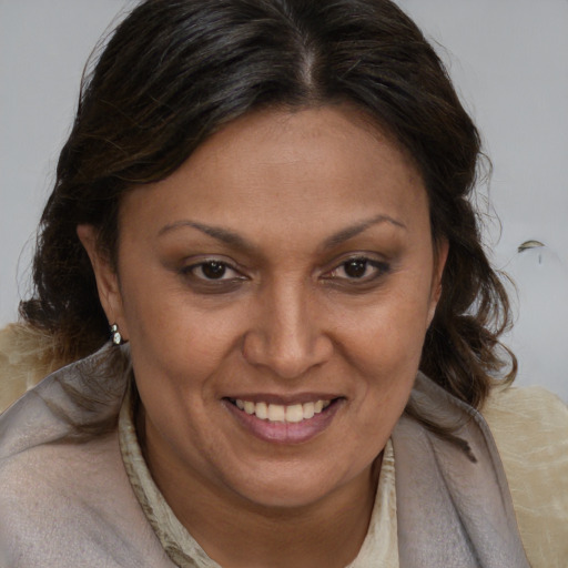 Joyful white adult female with medium  brown hair and brown eyes