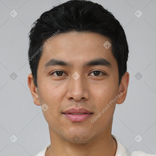 Joyful asian young-adult male with short  black hair and brown eyes