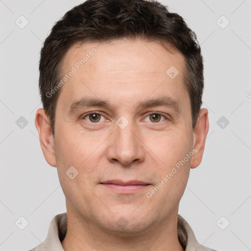 Joyful white adult male with short  brown hair and brown eyes