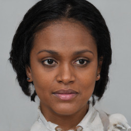 Joyful black young-adult female with medium  brown hair and brown eyes