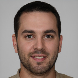 Joyful white young-adult male with short  brown hair and brown eyes