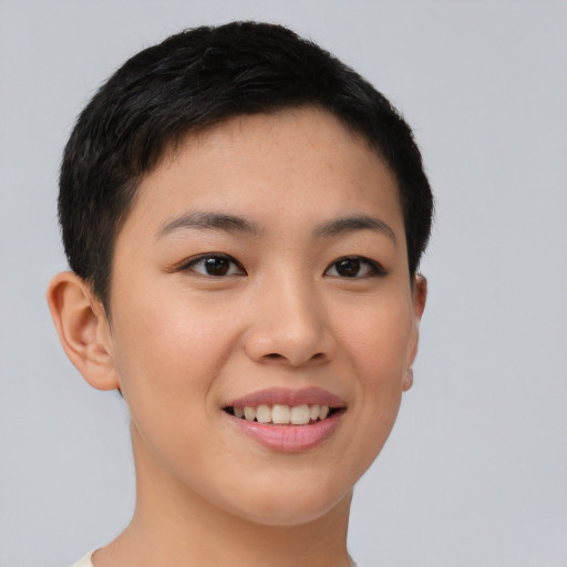 Joyful asian young-adult female with short  brown hair and brown eyes