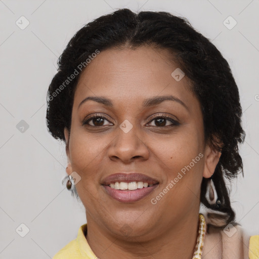 Joyful latino adult female with short  brown hair and brown eyes