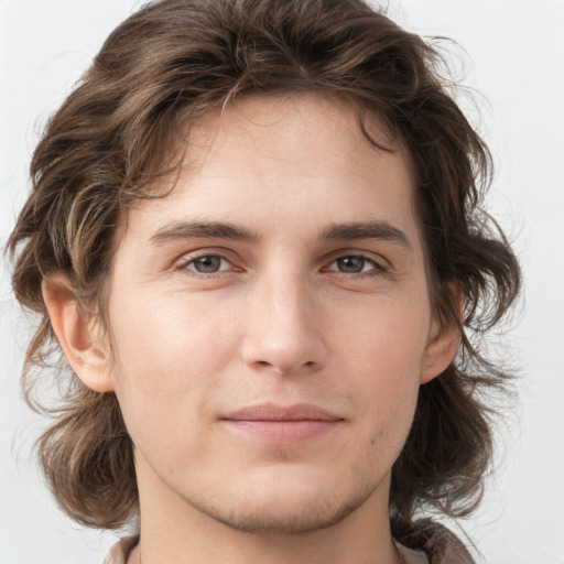 Joyful white young-adult male with medium  brown hair and brown eyes