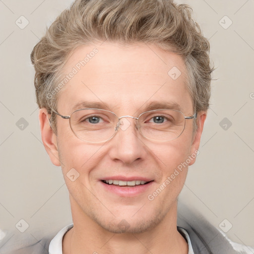 Joyful white adult male with short  brown hair and grey eyes