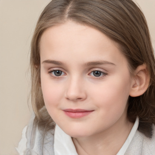 Joyful white child female with medium  brown hair and brown eyes