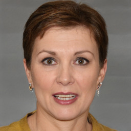 Joyful white adult female with short  brown hair and grey eyes