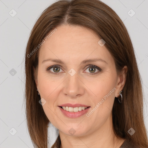 Joyful white adult female with long  brown hair and brown eyes