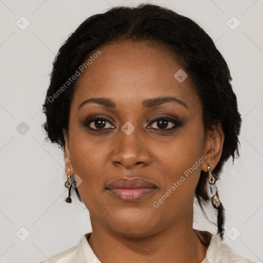 Joyful black adult female with short  brown hair and brown eyes