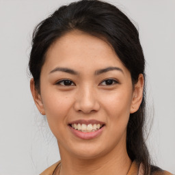 Joyful asian young-adult female with short  brown hair and brown eyes