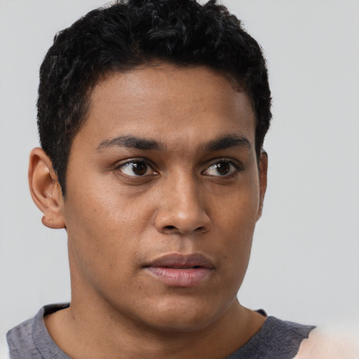 Neutral latino young-adult male with short  brown hair and brown eyes