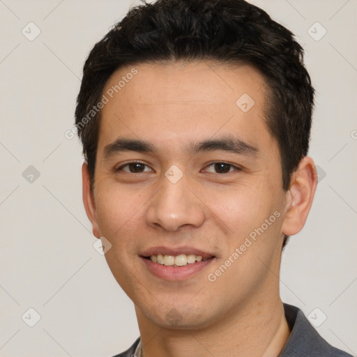 Joyful white young-adult male with short  black hair and brown eyes