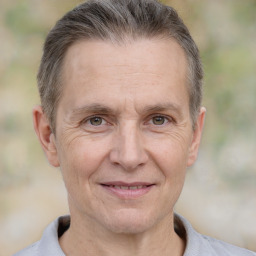 Joyful white middle-aged male with short  brown hair and brown eyes