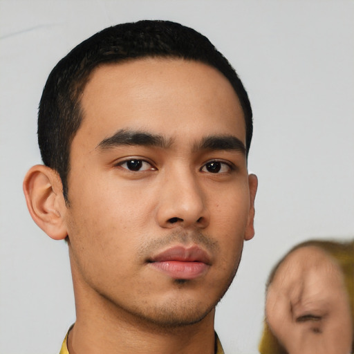 Neutral latino young-adult male with short  black hair and brown eyes