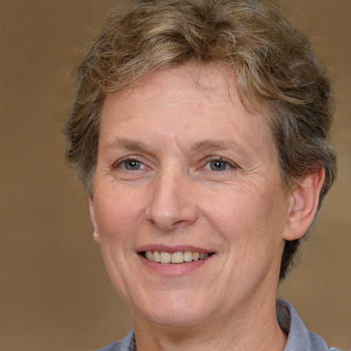 Joyful white middle-aged female with short  brown hair and brown eyes