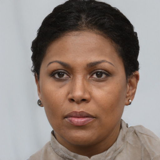 Neutral black adult female with short  brown hair and brown eyes