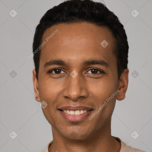 Joyful white young-adult male with short  black hair and brown eyes