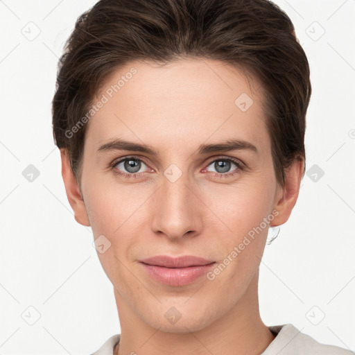 Joyful white young-adult female with short  brown hair and grey eyes