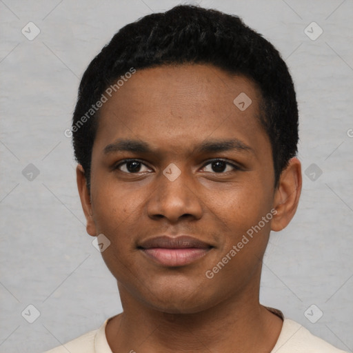 Joyful black young-adult male with short  black hair and brown eyes