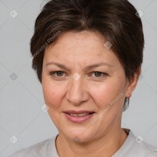 Joyful white adult female with short  brown hair and brown eyes