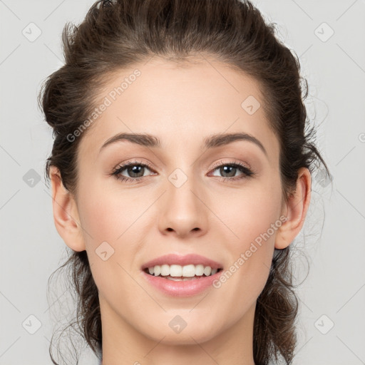 Joyful white young-adult female with medium  brown hair and grey eyes