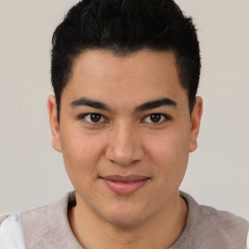 Joyful latino young-adult male with short  black hair and brown eyes